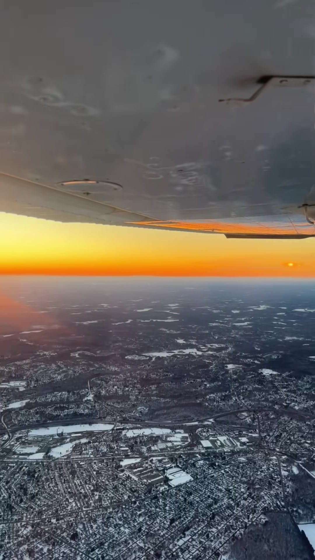 Sunset beneath an aircraft wing during a Pilots N Paws rescue flight